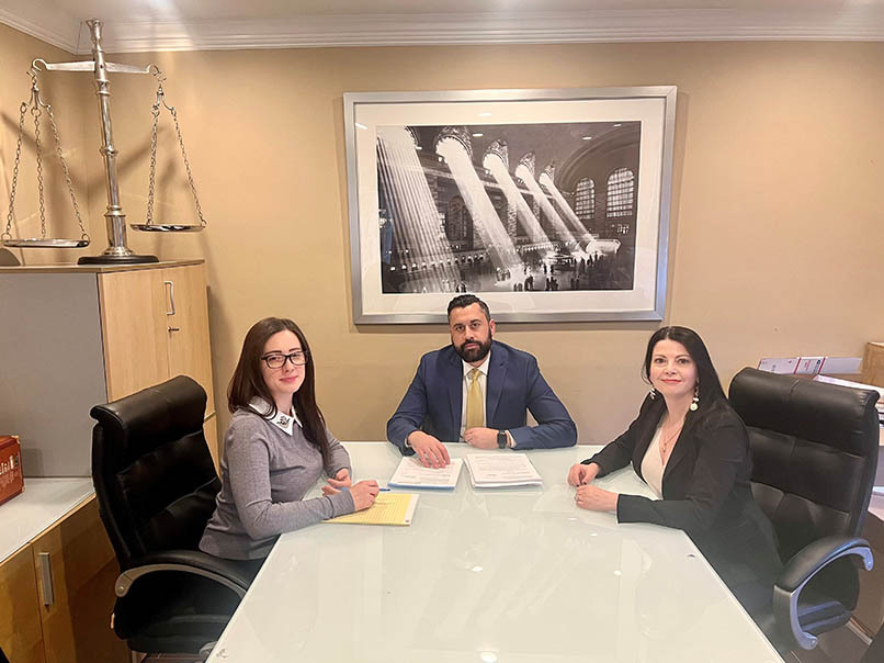 Probate lawyer consulting with clients to review estate planning documents and probate process.